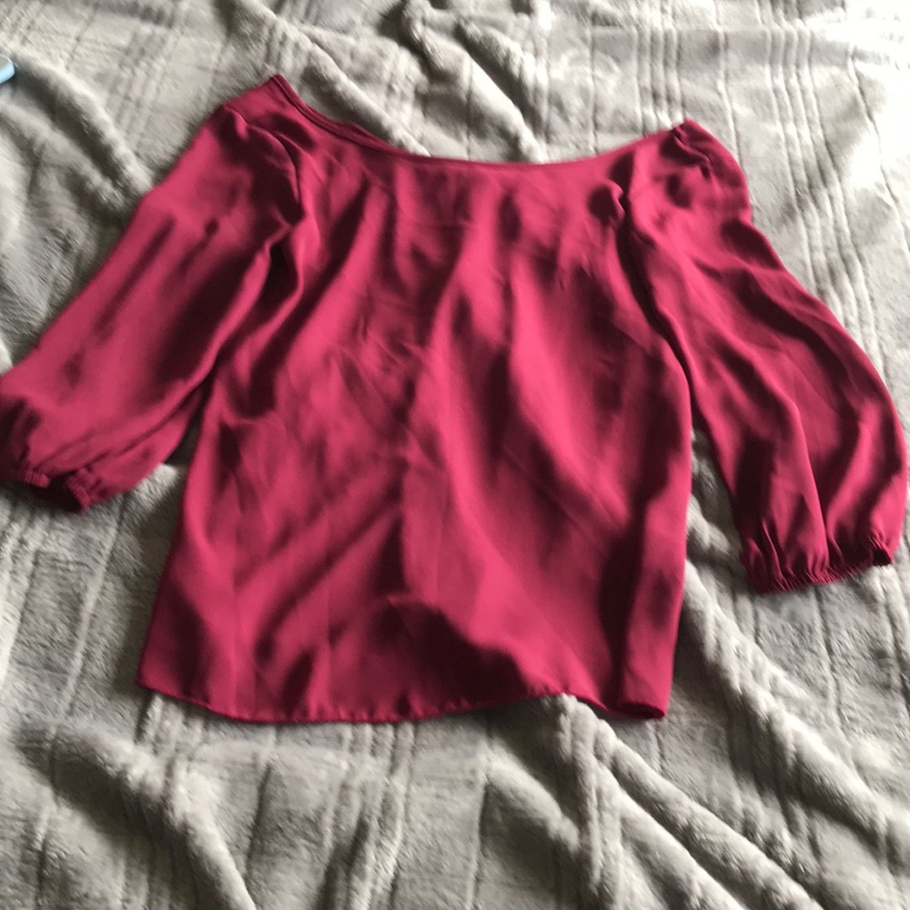 Maroon blouse and bow accent